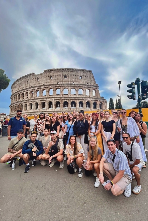 Large group in front of the Colosseum.
