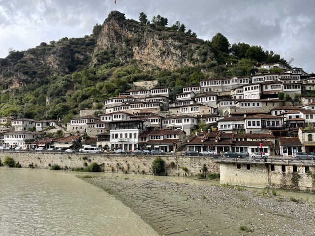 Traditional hillside village with stone houses.