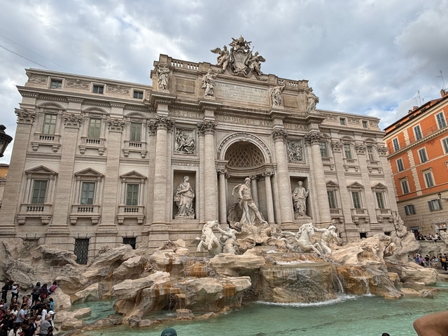       Fontana di Trevi in Rome with intricate sculptures.
  