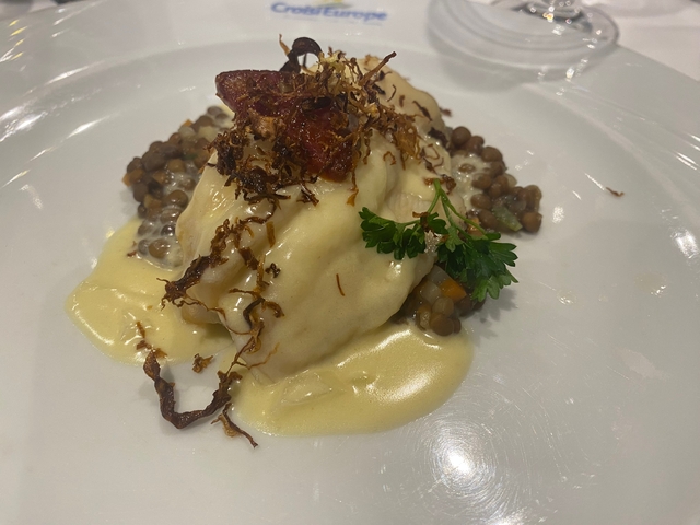 Cooked dish with sauce served on a plate.