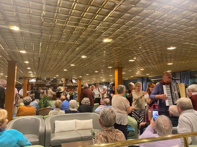 People enjoying music and dancing indoors.