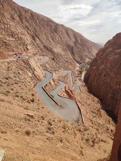       Winding road through red canyons.
  