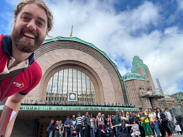       Architectural building with a group of people in front.
  