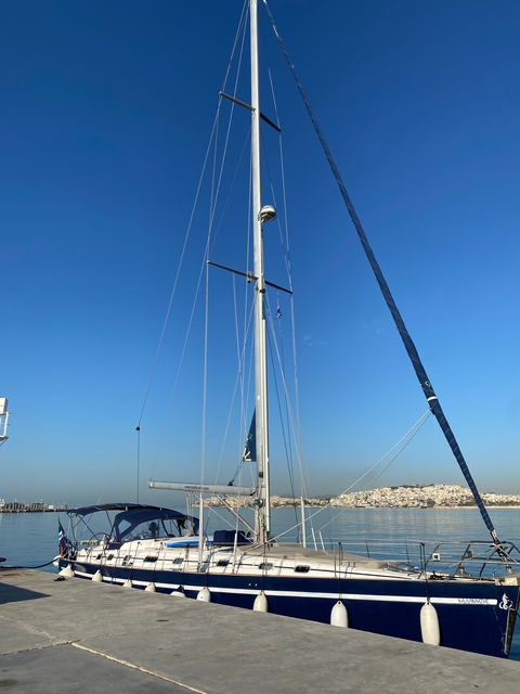 Tall sail mast under a clear blue sky.