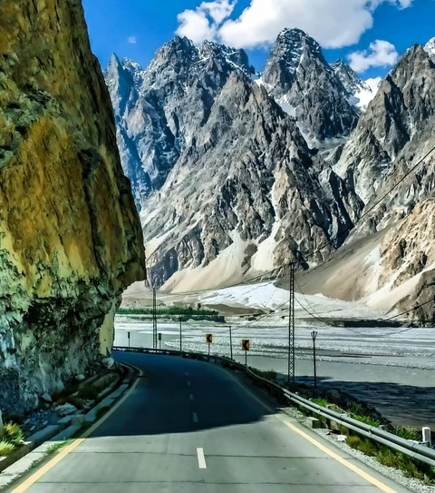 Curved road through a mountainous landscape.
