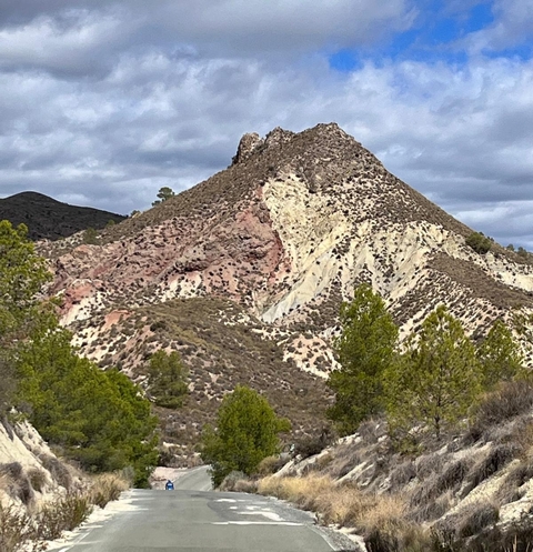 Rocky mountain with various sediment layers