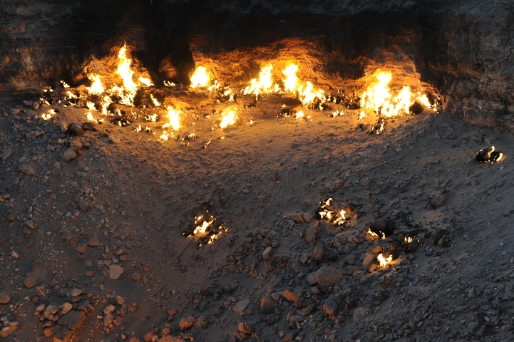 Darvaza gas crater with flames emerging from the ground