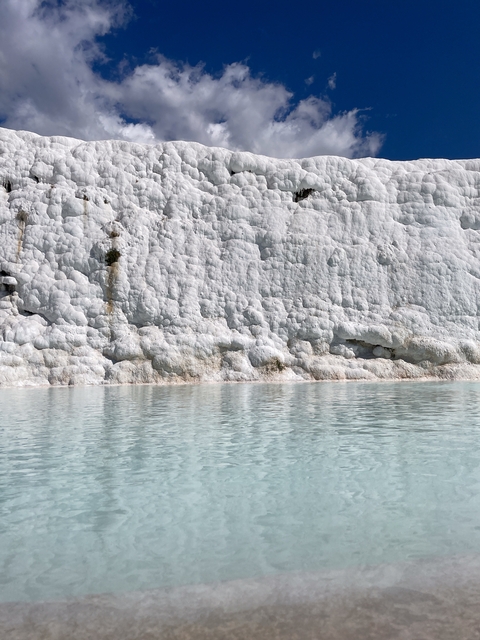 Mineral deposits and turquoise water at Pamukkale.