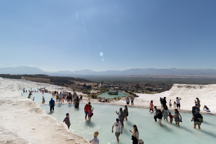 Tourists enjoying the thermal pools at Pamukkale.