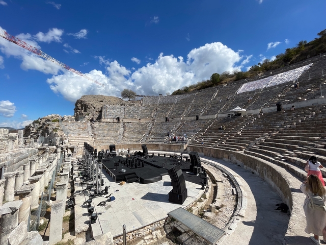 An ancient amphitheater set up for a performance.
