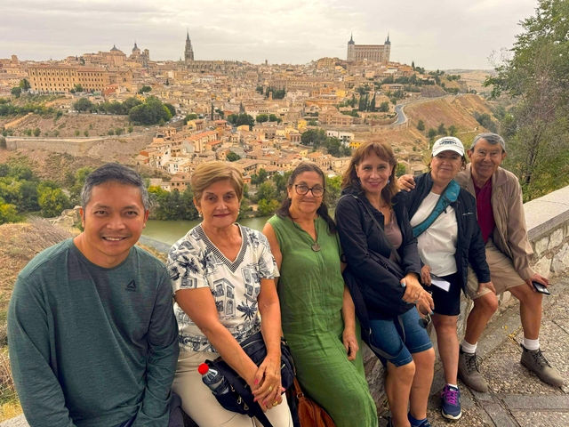 Group of people sitting with a panoramic view of a city