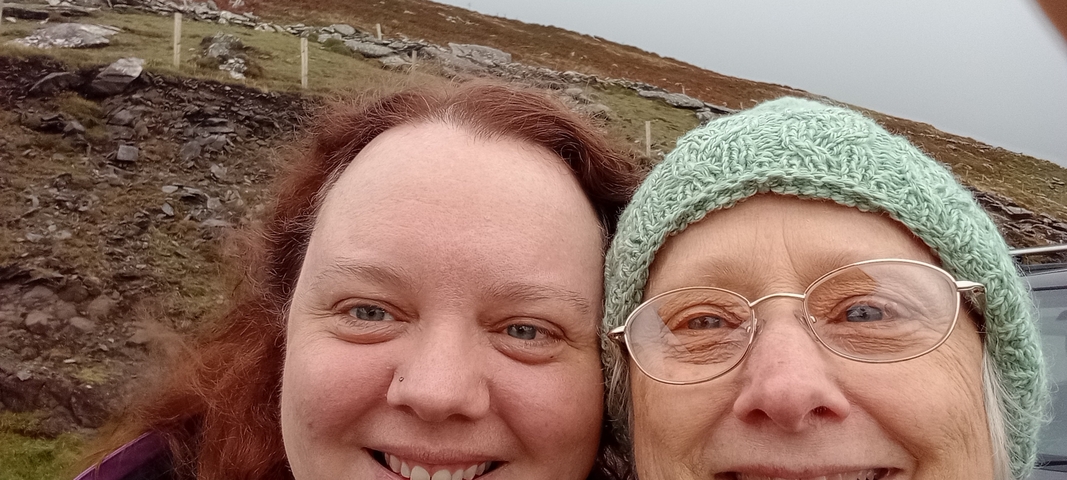 Two women taking a close-up selfie.