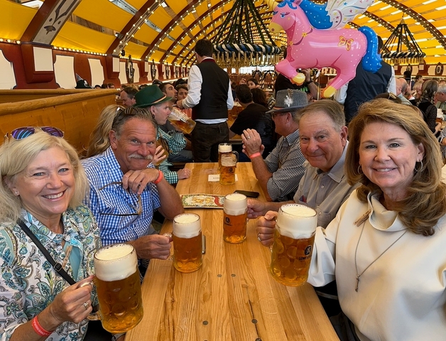 People enjoying drinks in a traditional beer hall.