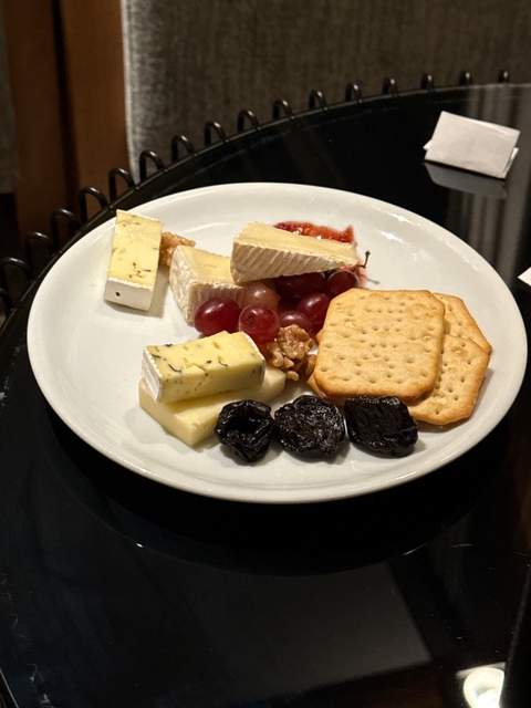 Cheese platter with crackers and fruit