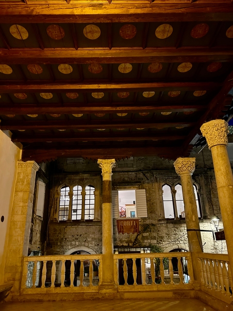       Historic columns and architectural details at night.
  