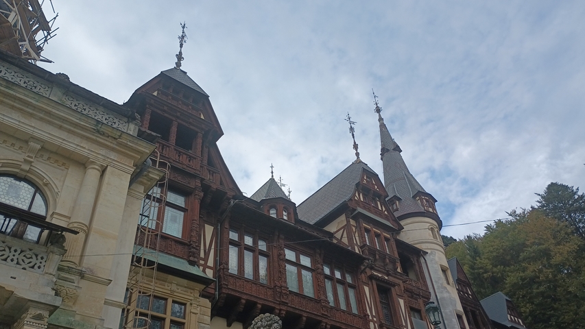       Historic building with ornate architecture and spires.
  