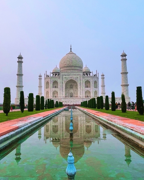 Taj Mahal with reflection in water feature.