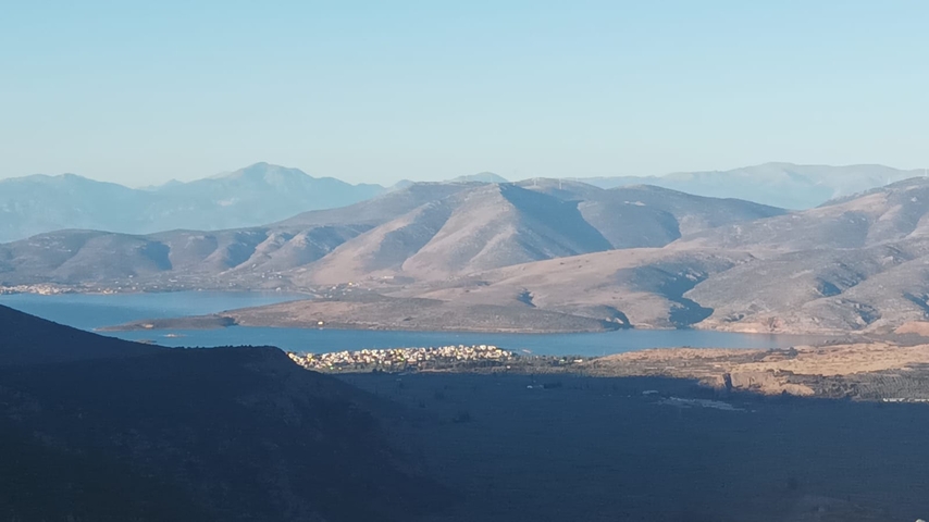       Scenic view of mountains and a body of water.
  