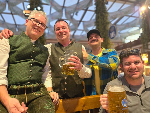 Group of friends holding beer mugs together