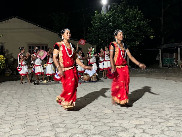 Group of people in traditional Nepalese dress performing
