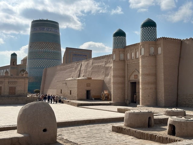Historic architecture with large blue and white tiles under a blue sky.