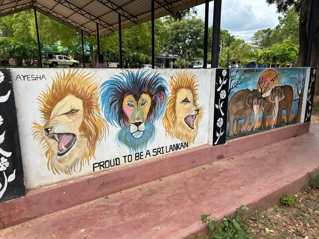       Mural depicting lions and elephants emphasizing national pride.
  