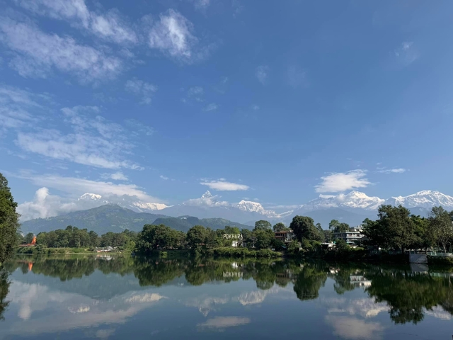 Reflection of mountains on a lake in Pokhara.