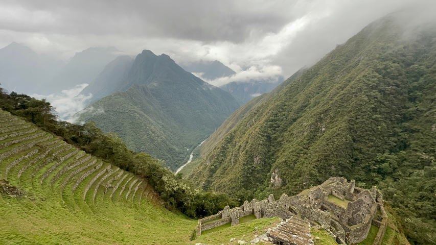       Panorama of mountainous landscape in cloudy weather.
  