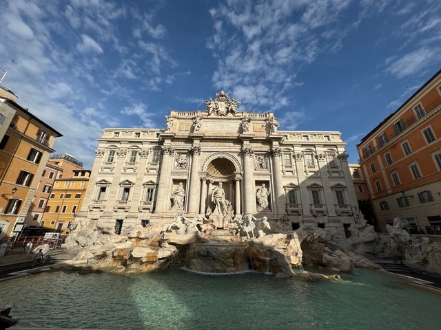       Baroque fountain and historic architecture in a city square
  