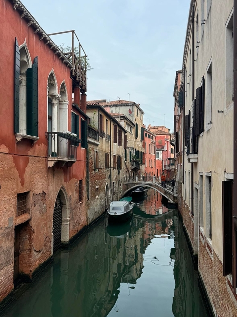       Canal view with traditional Venetian buildings
  