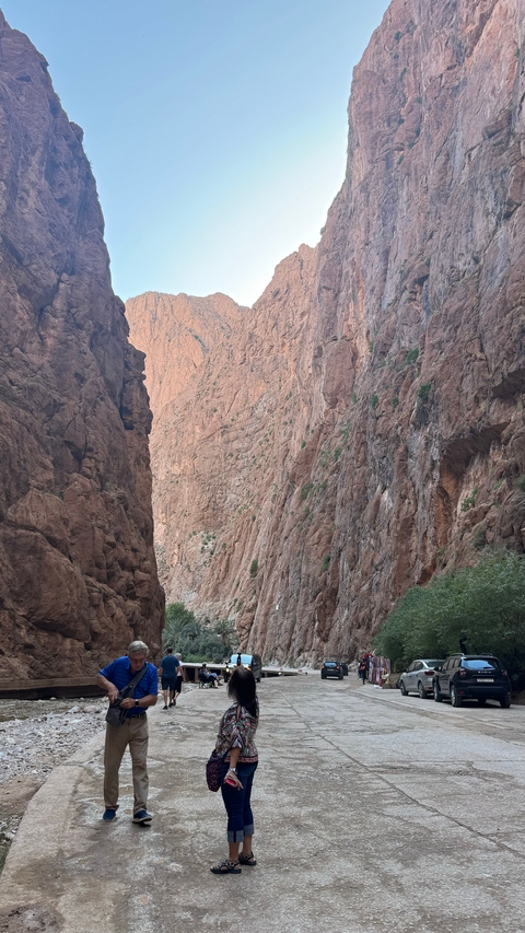       Tall rocky cliffs creating a gorge.
  