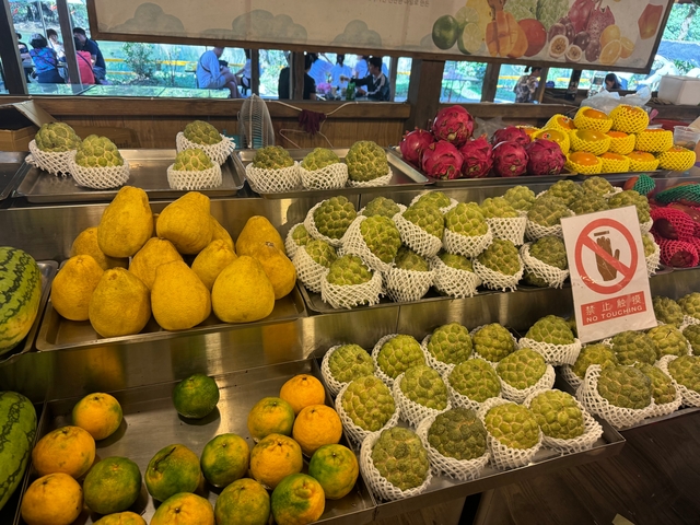 A market stall with various fruits on display.