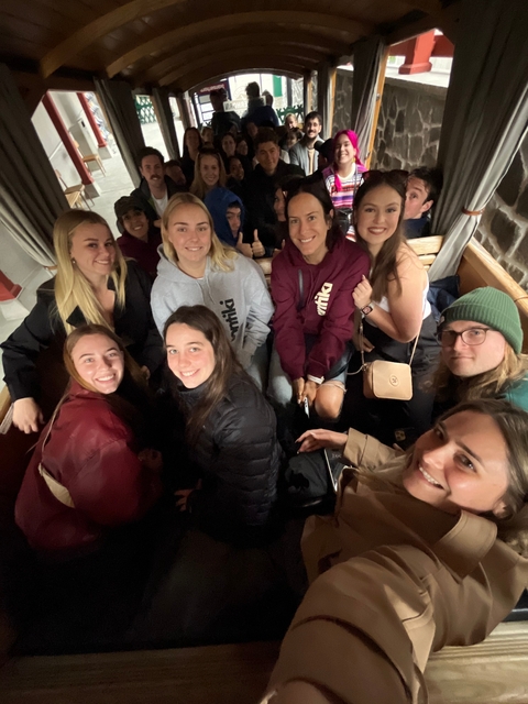 Group of people in a cozy indoor setting.
