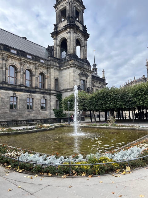 Fountain in front of a historic building.