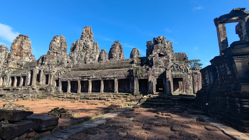       Ancient temple ruins with a blue sky background.
  