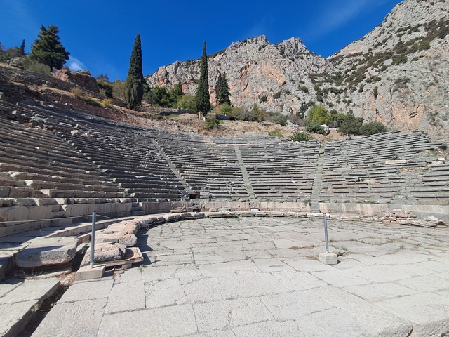       Ancient amphitheater with stone seating.
  