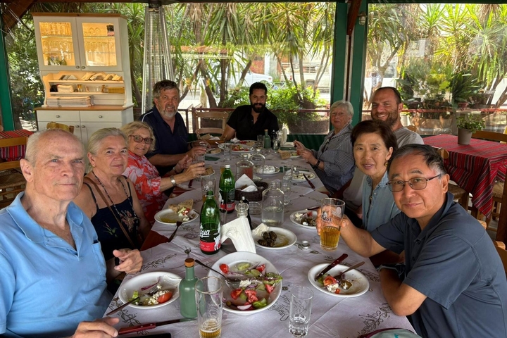 Group of people having a meal at a table.