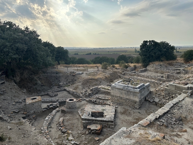 Ruins of an ancient archaeological site with natural surroundings.