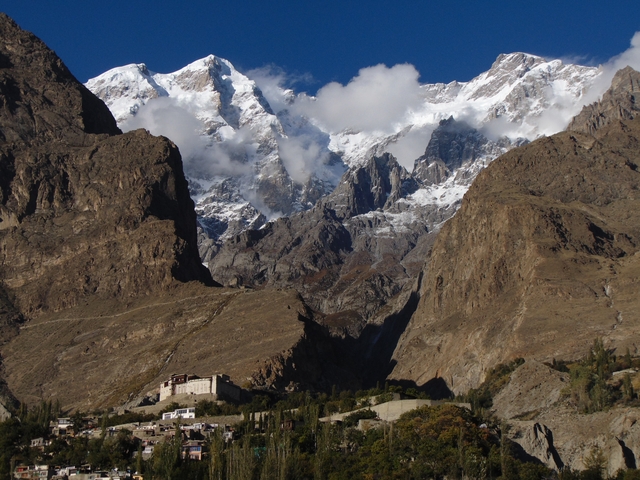 Mountain range with snow-capped peaks and rocky landscape.
