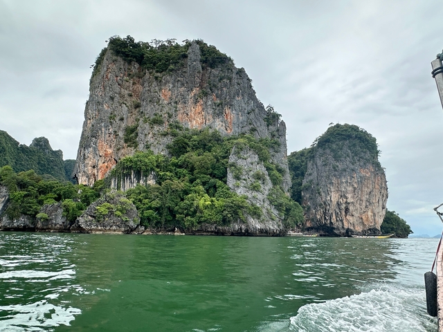       Dramatic rocky cliffs rising from the sea.
  