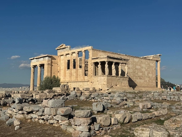       Ancient temple ruins under a clear sky.
  