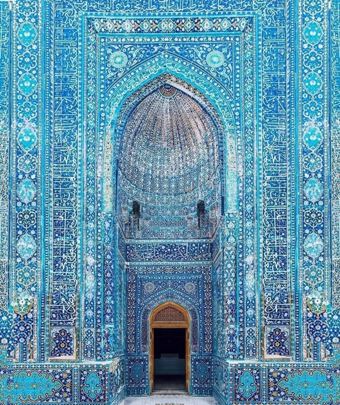 Intricate blue tile work in a historic building.