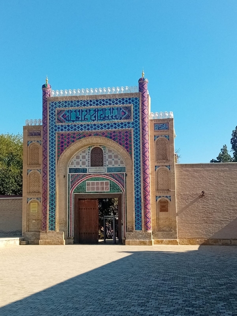       Ornate gate with colorful mosaic design.
  