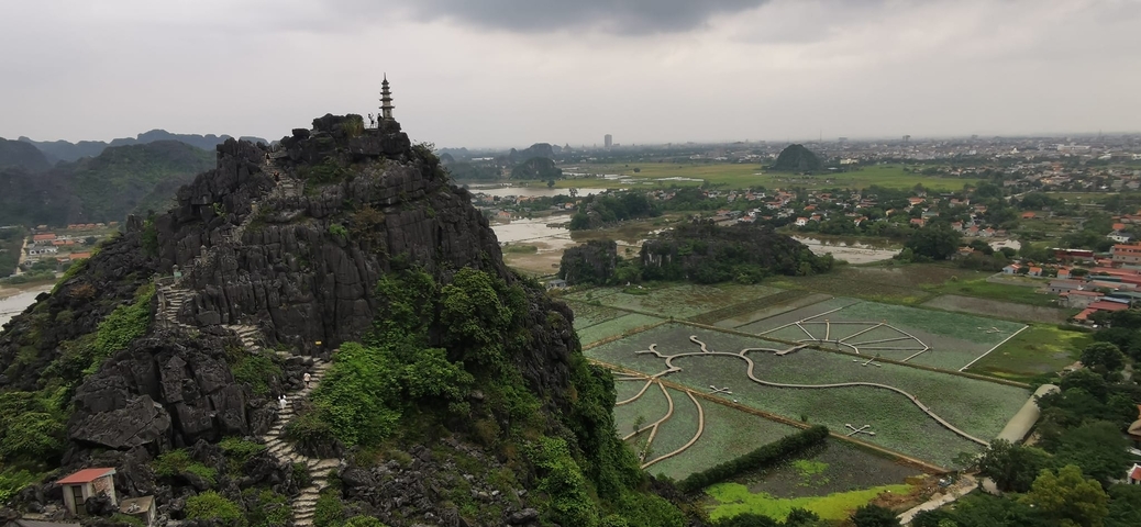 Scenic view of limestone mountains and rice fields.