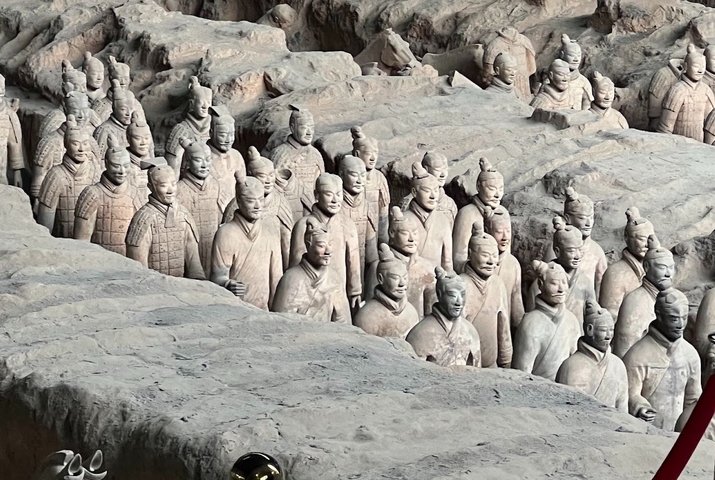 Terracotta Warriors in a large excavation pit.