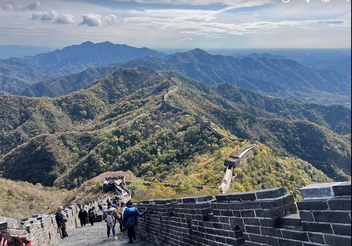 Great Wall of China stretching across mountainous terrain.