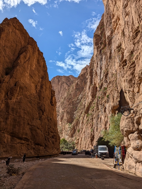       Rocky canyon walls under a clear blue sky.
  