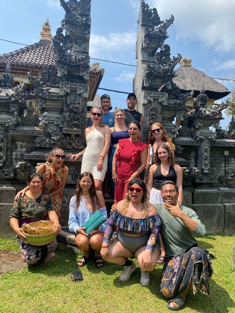       Group of tourists at a temple.
  