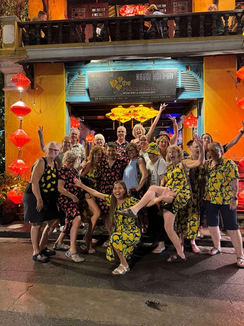       Group photo with vibrant lanterns at night
  