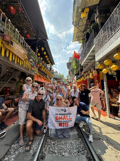       Group of people posing in a lively street
  